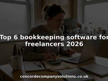 Freelancer updating bookkeeping at kitchen table