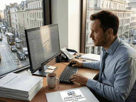 Accountant reviewing statutory accounts in busy office