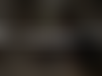 Sole trader managing bookkeeping in home kitchen