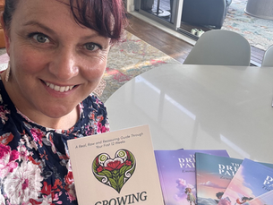 Author Toni Pirini holding her book Growing a Mum with The Dream Palace children’s bedtime story series