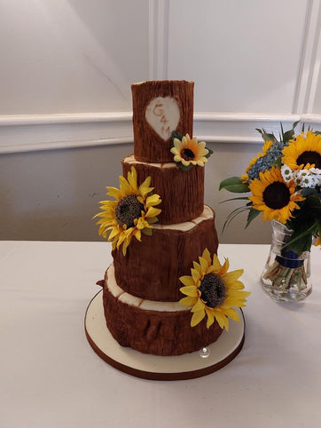 Hand sculpted tree wedding cake with silk sunflowers - Tracy's treats cake design