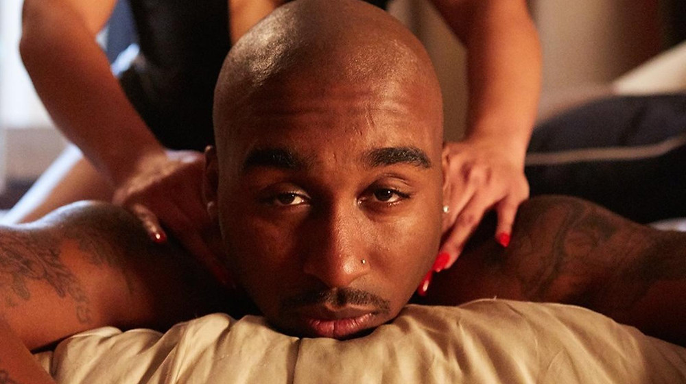 Tupac, played by Demetrius Shipp Jr., gets a massage. Still via Facebook