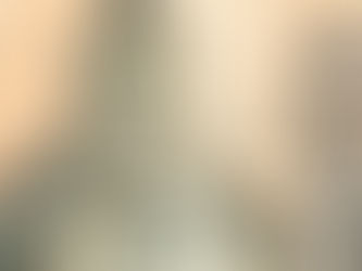 An illustration in mostly grayscale, with only a light pinkish sky and pops of light red for color, shows a decaying castle-like structure. Atop the structure, a woman lays dejectedly among the decay. A large robotic figure holding a light bulb and “T” looms behind and over the structure. Smaller human figures throughout the bottom portion of the crumbling structure engage in various activities.