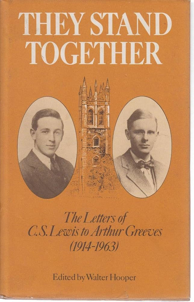 A faded orange book cover features “They Stand Together” in big bold white letters at the top. In the middle, two ovals frame pictures of CS Lewis and Arthur Greeves respectively. A tower sits between the two photographs. The bottom of the cover features the words “The Letters of CS Lewis to Arthur Greeves, 1914-1963,” in black italic script.