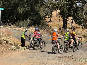 a group of electric bike tour riders in mariposa, california