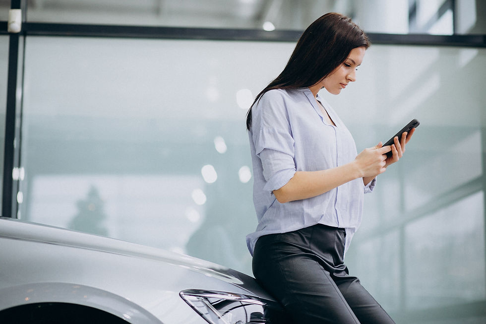 young-woman-car-show-room-using-phone.jpg