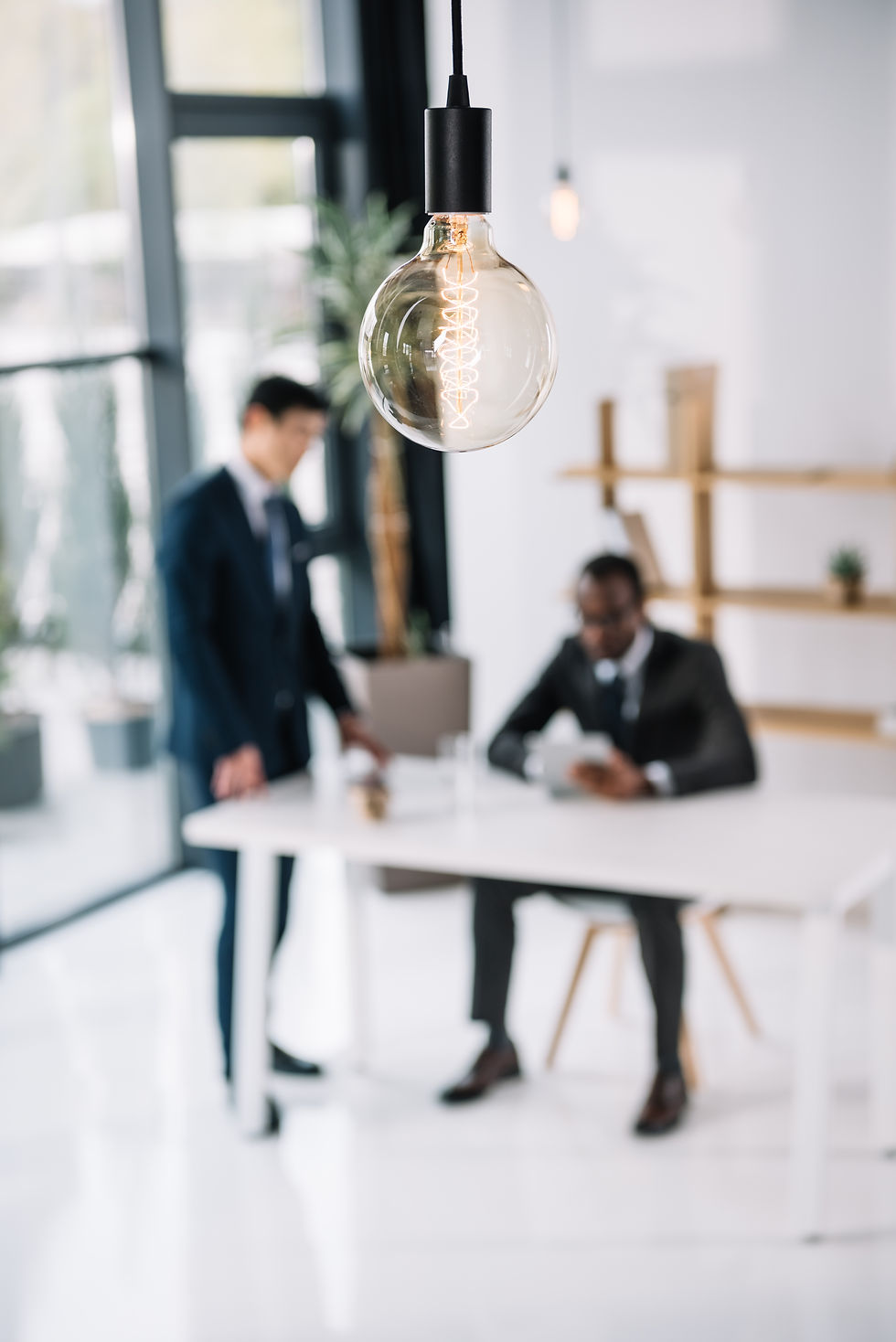 vintage lamp with business colleagues sitting in room