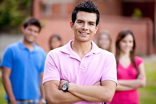 casual-man-smiling-outdoors-with-a-group-behind-hi-2026-01-09-14-54-34-utc.jpg