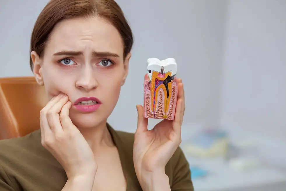 A female patient with aching teeth is visiting an emergency dentist in Golden Triangle, DC.
