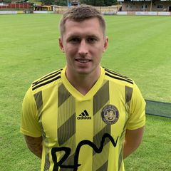 Midfielder signs from Salisbury.