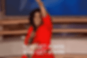 Oprah Winfrey wearing a red dress, saying, "You get a win."