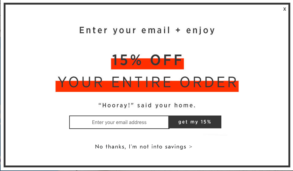A modal with a 15% discount offer that gives the user an option to input their email address or click a button that says 'No thanks, I'm not into savings.'
