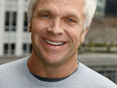 Mike Slade smiling in a close-up portrait.