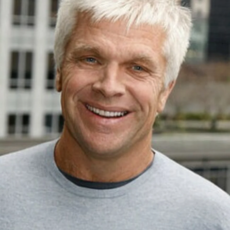Mike Slade smiling in a close-up portrait.