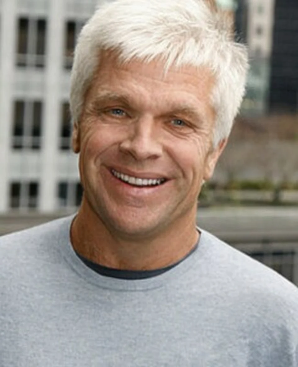 Mike Slade smiling in a close-up portrait.