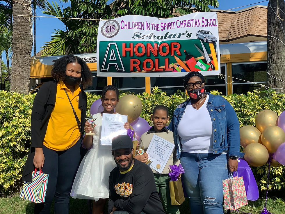 CIS Scholar's A Honor Roll students with family.