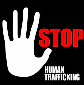 A white hand symbol with the word "STOP" in red and "HUMAN TRAFFICKING" in white text below, set against a black background,