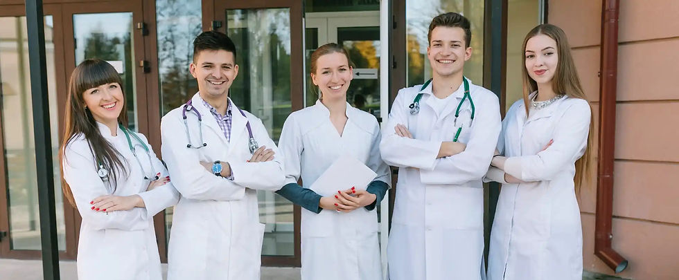 Smiling medical team outside hospital