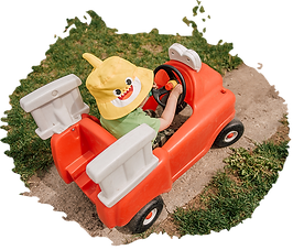 little kid driving toy car at Little Minds Childcare