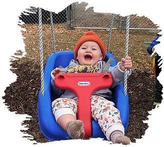 Little boy playing on swing