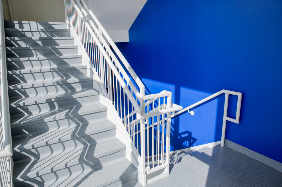 office stairwell with bright blue wall 