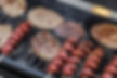 burgers and hotdogs on the grill