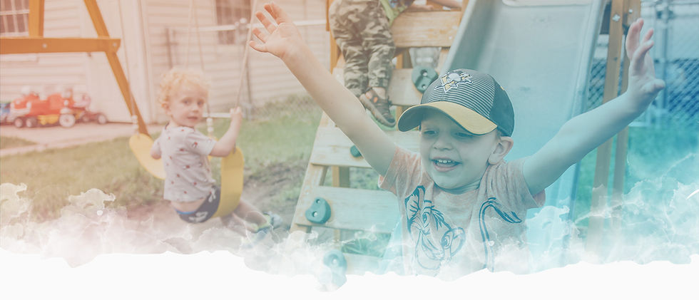 kid going down slide at little minds  childcare