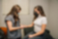 Hilary Nelson, PA-C working with patient