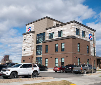 outdoor view of large bank building with beautiful blue sky