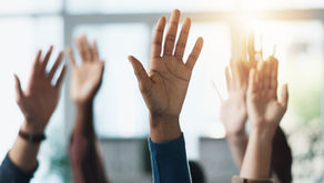 Hands Raised Asking Questions at Church Meeting