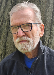 John Rakauskas, member of the Art House's board. John is wearing a grey jacket and glasses.