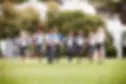 A view of private and government school students running outdoors.