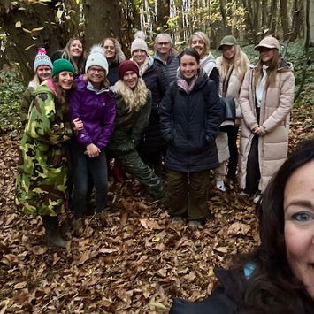 Julie Willis and group in a wooded area