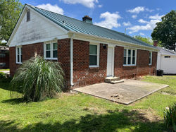 Back corner of house by kitchen.