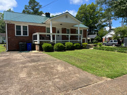 Front of house with driveway.