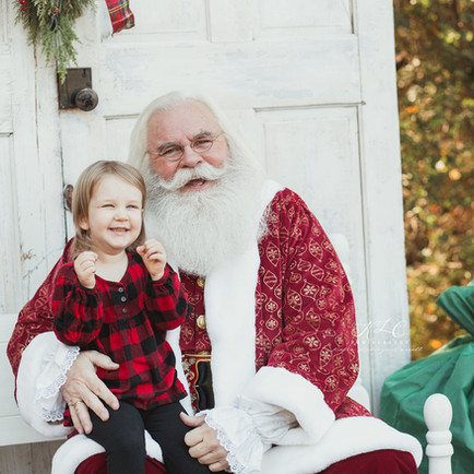Little girl with Santa Claus