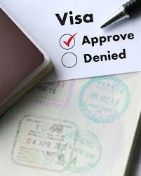 Close-up of an approved visa application with passport and travel stamps. Represents professional visa services, travel insurance coverage, and hassle-free international travel planning.