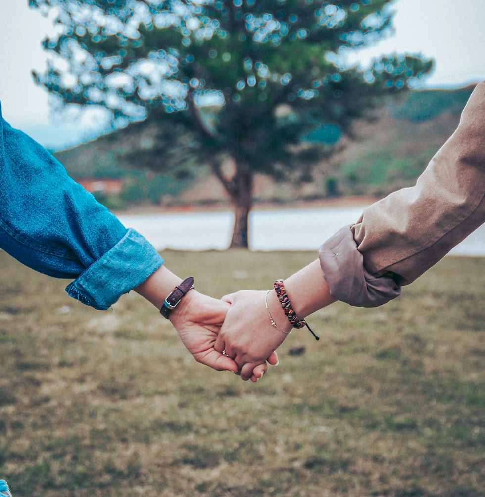 Couple holding hands as they navigate fertility treatment