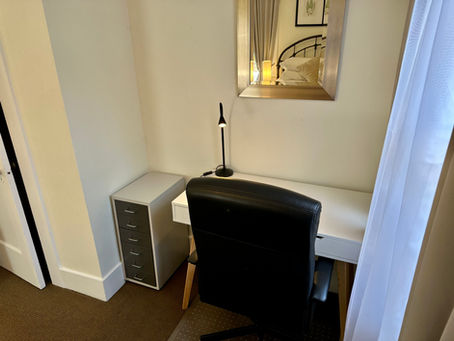 Large bedroom, there is a desk, light, storage, and an office chair