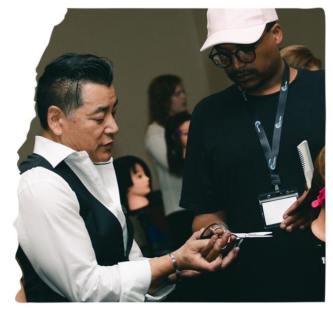 Stylist performing a haircut using ergonomic technique