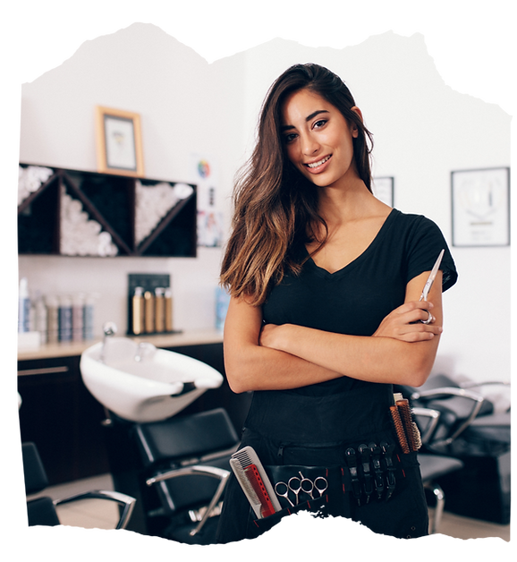 Certified stylist holding ergonomic shears with confidence