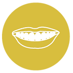 A round yellow icon showing clip art of a smile with teeth.