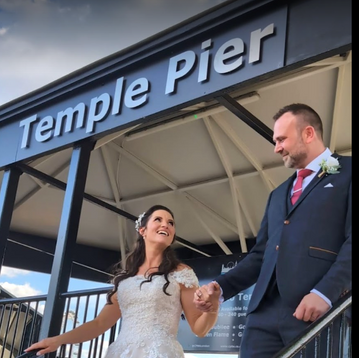 Happy bride at Temple Pier about to board her boat.