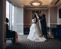 Putting veil on bride at City Club in Birmingham, AL.