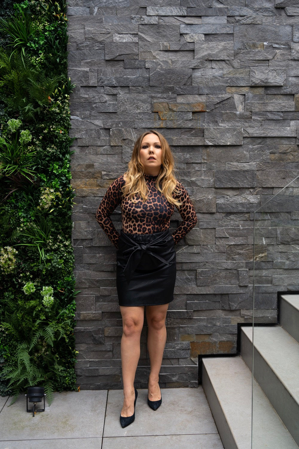 Black leather look skirt with bow detail