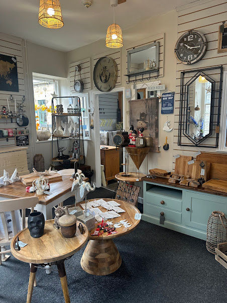 Photo of the inside of the store showing bespoke furniture, unique homeware along with seasonal pieces
