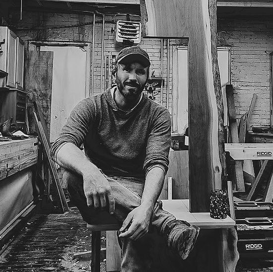Ryan Zajac of crowned rabbit studio in his shop