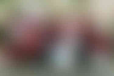 small bridal party wearing blue dresses and flower crowns in front of the pitruco pizza truck in philadelphia at their wedding reception