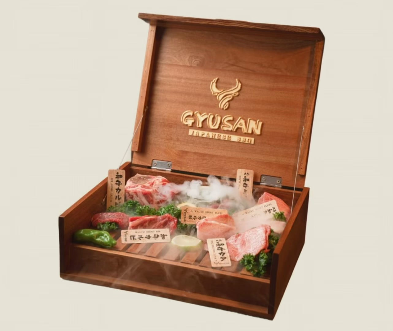 A wooden Gyusan box of marbled Wagyu cuts