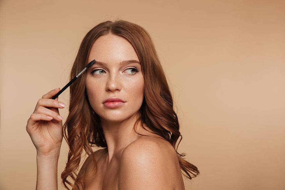 beauty-portrait-calm-ginger-woman-with-long-hair-looking-away-posing-sideways-while-combin